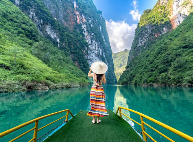 The Nho Que River offers unforgettable views with dramatic mountain landscapes, peaceful boat rides, and pristine natural beauty.