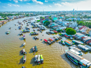 Experience the lively atmosphere of Cai Rang Floating Market, where colorful boats, fresh local produce, and authentic culture create unforgettable memories on a Southern Vietnam Tour.