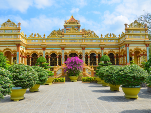 Discover the beauty of Vinh Trang Pagoda, where traditional Vietnamese, Chinese, and Khmer architectural styles blend in a serene spiritual setting.