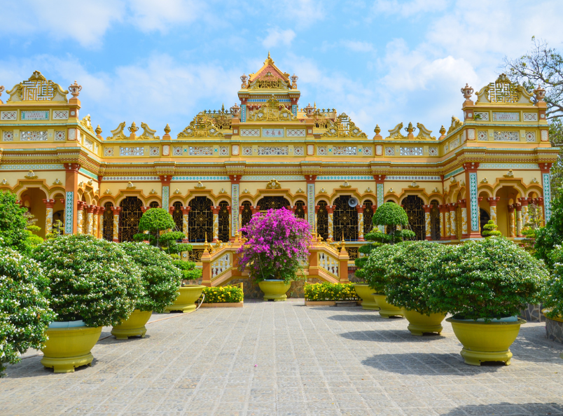 Discover the beauty of Vinh Trang Pagoda, where traditional Vietnamese, Chinese, and Khmer architectural styles blend in a serene spiritual setting.